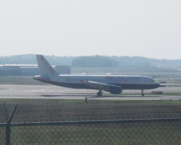 Airbus A320 (N266AV) - Getaway 388 Arrives 36R from Cancun.    Taken: 8/22/2010