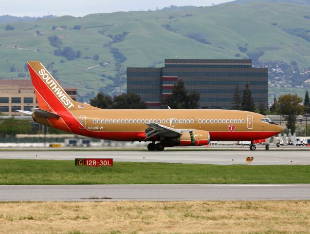 BOEING 737-300 (N348SW) - KSJC - Southwest 737-300 touching down on 12R at San Jose Mar 27th, 2005. hit full for larger view.