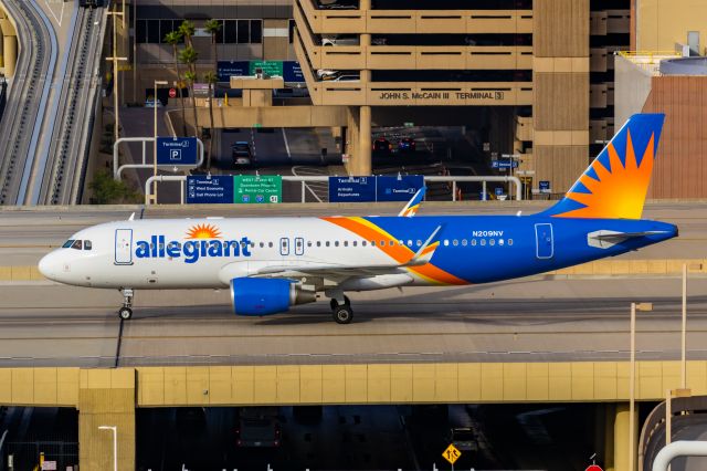 Airbus A320 (N209NV) - An Allegiant A320 taxiing at PHX on 2/13/23, the busiest day in PHX history, during the Super Bowl rush. Taken with a Canon R7 and Canon EF 100-400 II L lens.