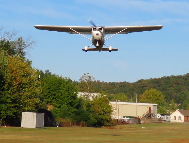 Cessna 175 Skylark (N9276B) - I was standing next to the fence between my back yard and Blue Lick airport. Blue Lick is a 2000 foot grass strip, dawn to dusk airport. 