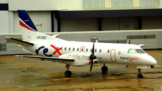 Saab 340 (VH-ZRZ) - In the terminal on a rainy day.