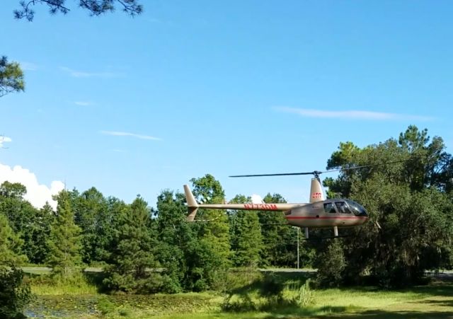Robinson R-44 (N773DM) - CTN Express - Landing at a tower site near Tallahassee, Florida 32312