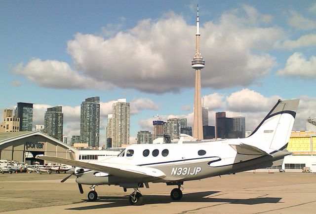 Beechcraft King Air 90 (N331JP) - RELIANT AIRs King Air 90 parked downdown Toronto. RELIANT AIR sells the cheapest fuel at Danbury airport!