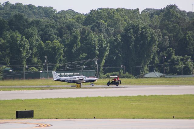 Piper Saratoga/Lance (N100LW) - Being tugged across runwaybr /Owned By: ?