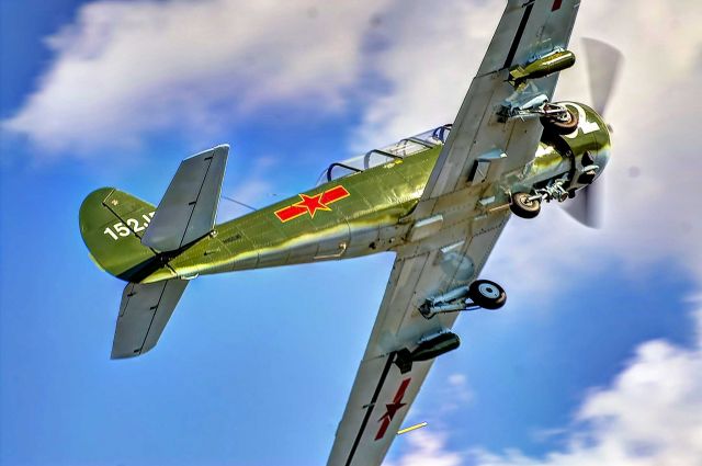 YAKOVLEV Yak-52 (N152JB) - A Yak pitches up for landing at the Auburn, Alabama airport.