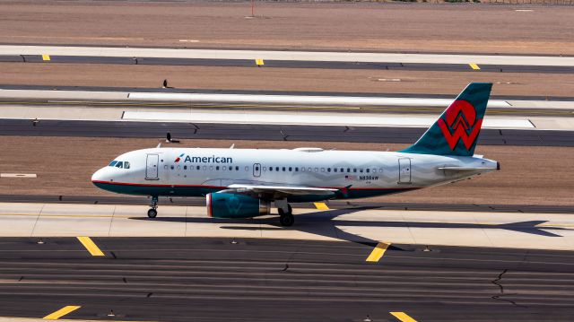 Airbus A319 (N838AW) - American Airlines A319 in America West retro livery taxiing and PHX on 8/20/22. Taken with a Canon 850D and Rokinon 135mm f/2 manual focus lens.