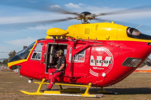 ZK-HJC — - A wonderful sunny day  on 1 May 2016 was spent at the Air Rescue and Emergency Services Open Day at Garden City Helicopters. Super-cool-dude-helicopter-paramedic absorbing some vitamin D, just before liftoff for a winching display.