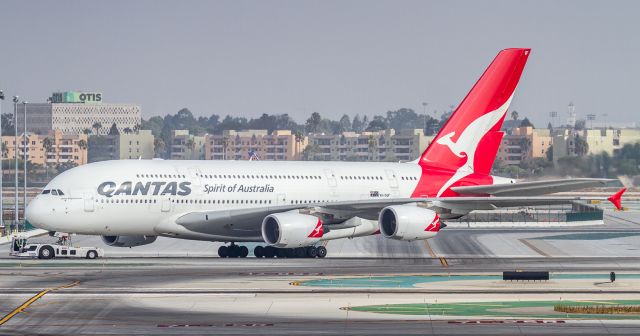 Airbus A380-800 (VH-OQF) - After unloading her pax and cargo at TBIT this QANTAS super is towed to a remote stand for the day