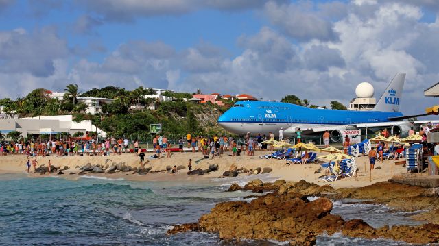 Boeing 747-400 (PH-BFB) - Maho Beach. In rolling before  enthusiast people.Sunset bar on the right.