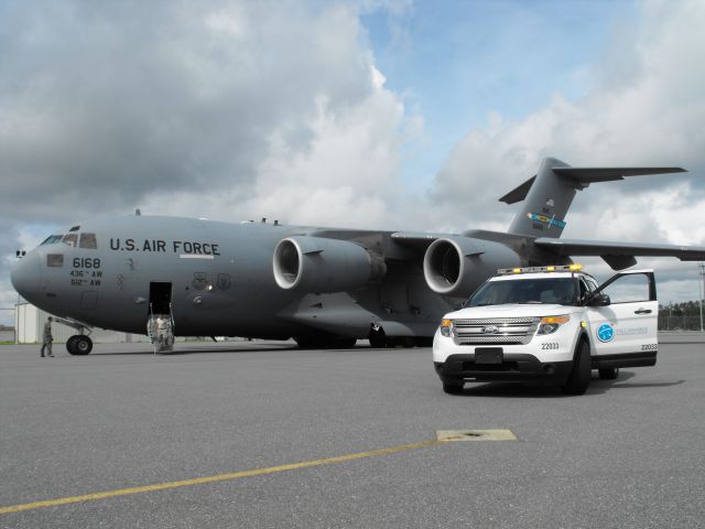 Boeing Globemaster III (06-6168) - One of my last pictures taken with Airport Ops at TLH. Truck 33 with a C-17 on the north ramp for VP Bidens visit. 