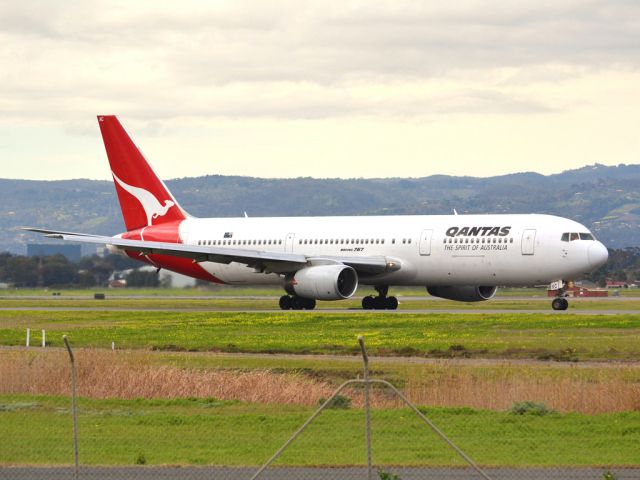 BOEING 767-300 (VH-ZXC) - On taxi-way heading for take off on runway 05, for flight to Sydney. Thursday 12th July 2012.