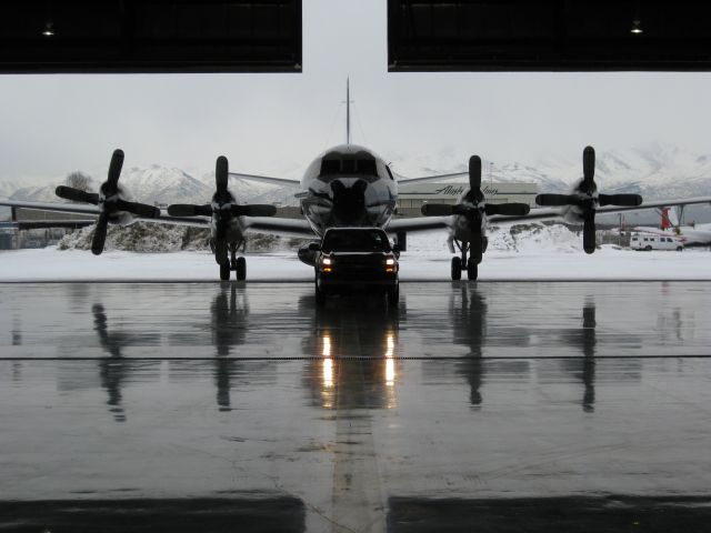 NOAA43 — - Towing Miss Piggy into the FAA Hangar in Anchorage