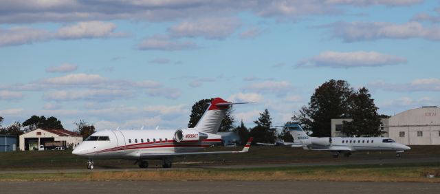 Canadair Challenger (N696KT) - Taxiing to parking is this 1999 Bombardier Challenger 604 with the Learjet 45 right behind in the Autumn of 2021.