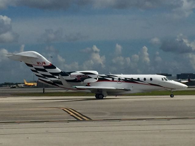 Cessna Citation X (N1JM) - This photo was taken on the flight line at Signature at Miami International while it was taxiing for takeoff.