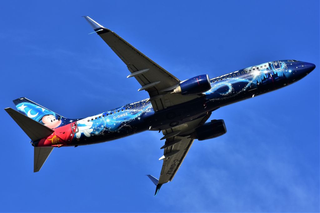 Boeing 737-800 (C-GWSZ) - WestJet (Disney's Micky Mouse Livery) Boeing 737-8CT departing YYC on May 11. 