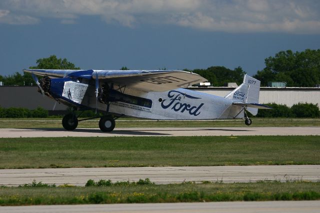 C1077 — - Ford Tri-Motor landing at the EAA Fly In 7-29-2005