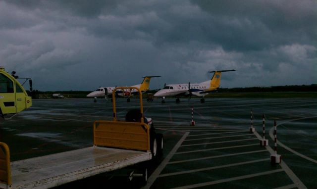 Cessna 402 (VQ-TDG) - Air Turks & Caicos Embraer 120s VQ-TMJ AND VQ-TDG STORMY day in the islands.