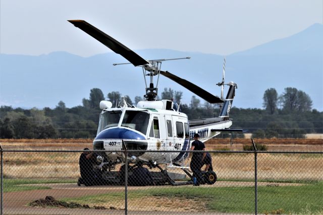 Bell UH-1V Iroquois (N407KC) - KRDD  - UH-1H or Kern County Fire department - on the ground at Redding, CA for the fires in northern California Sept 7, 2019. This was as close as I could get here at the joint Calfire/USFS Fire base at Redding Municipal Airport.