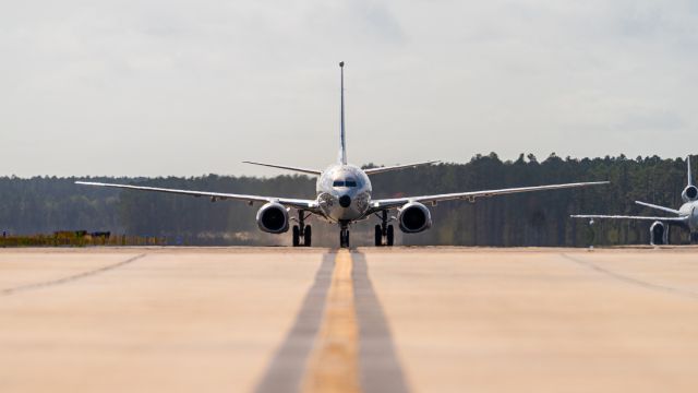 Boeing 737-700 — - Navy P-8 Poseidon taxing north on Delta for a Runway 18L departure.