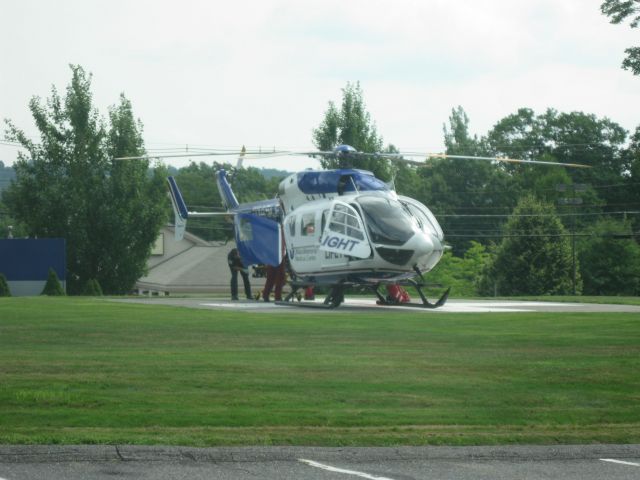 KAWASAKI EC-145 (N145LF) - Loading the patient for the flight to Worcester, MA (42MA).