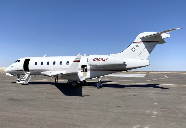 N969AF — - 2013 BOMBARDIER INC BD-100-1A10. Unloading bags after a flight from Scottsdale. 