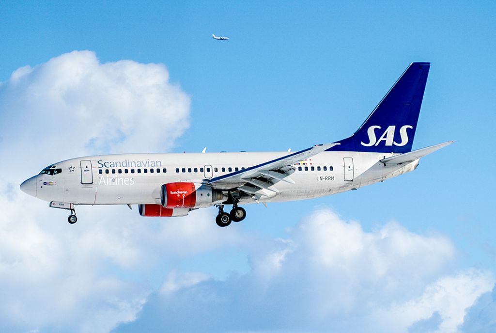 Boeing 737-700 (LN-RRM) - A 737-700 from SAS in the front, and a 737-700 from Braathens SAFE in the back, Oslo Airport 2005.