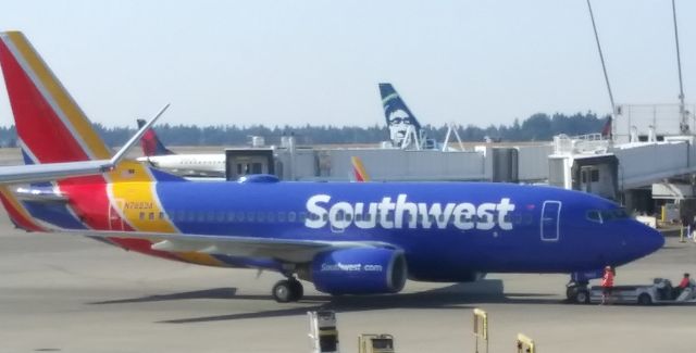Boeing 737-700 (N762SA) - This photo was taken from inside the "S" terminal at Sea-Tac while I was waiting for my flight to Iceland.