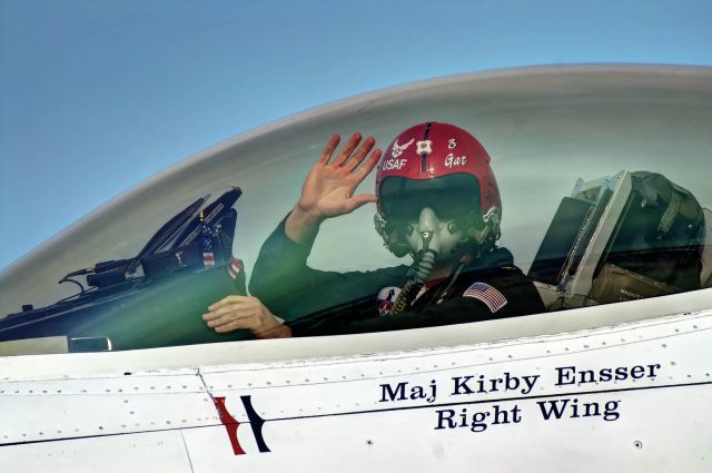 Lockheed F-16 Fighting Falcon — - Maj. Kirby Ensser, right wing for for U.S. Thunderbirds, gives a wave after a demonstration at Tyndall AFB.