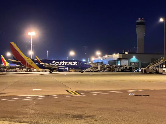 Boeing 737-700 (N923WN) - Reload rack as a Southwest B737-700 rest at cargo six, spot 1 with SeaTac tower in the background.