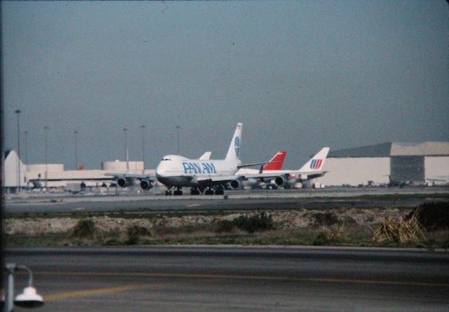 Boeing 747-200 — - SFO- view from the Airport  frontage road at SFO near 1R departure runway- one used to be able to park and watch aircraft here. Im sure this was Clipper Cathay.