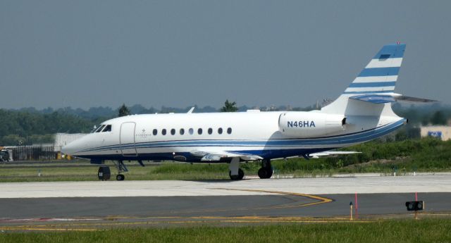 Dassault Falcon 2000 (N46HA) - Taxiing for departure is this 1999 Dassault Falcon 2000 in the Summer of 2021.