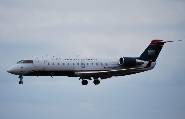 Canadair Regional Jet CRJ-200 (N218PS) - Final for 18L - 4/8/10