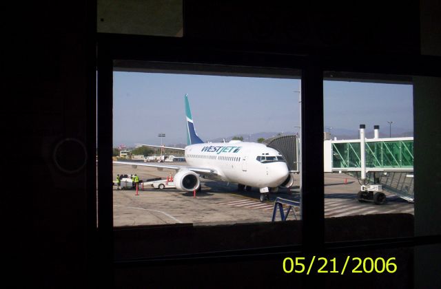 Boeing 737-700 — - Puerto Vallarta airport lounge. Love the all glass jetway