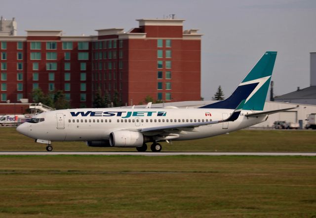 Boeing 737-700 (C-FWSX) - Departing for Vancouver.