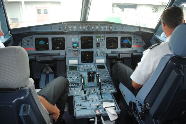 Airbus A321 — - Cockpit of our A321 at KCLT before departure to KLGA