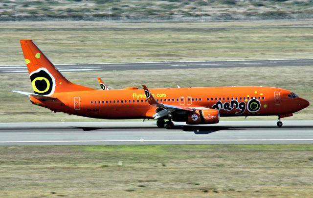 Boeing 737-800 (ZS-SJH) - Another South African airline that likes bright colour schemes that are different from side to side - photos through lounge glass are not always the best quality sorry