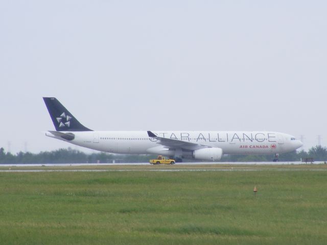 Airbus A330-300 (C-GHLM) - look at the size of it,compared to the birdman pick up.