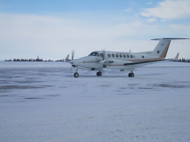 Beechcraft Super King Air 300 (C-GNLF) - Departing Woodward Aviation FBO Goose airport NL, April 16/09