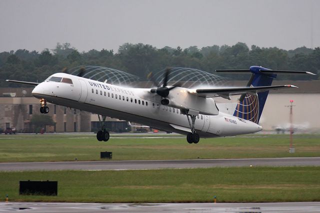 de Havilland Dash 8-400 (N34NG) - United Express (Colgan Air) N34NG (FLT CJC4890) departing RWY 5 en route to Newark Liberty Int'l (KEWR). Nice condensation from the tips of the prop blades.