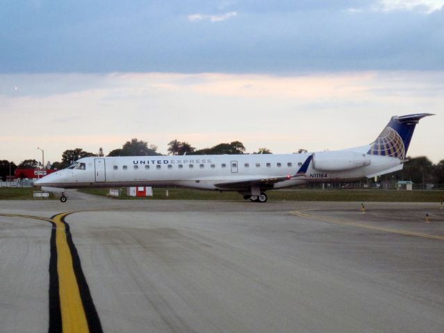 Embraer EMB-145XR (N11184) - Holding short runway 10L.