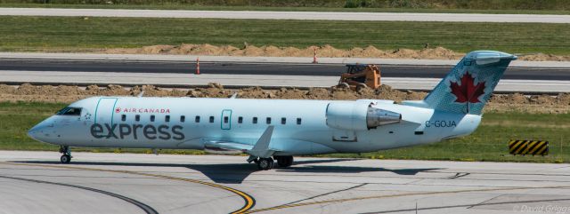 Canadair Regional Jet CRJ-200 (C-GOJA) - Air Canada taxiing at Port Columbus around a closed runway to the active.   Flight destination was Toronto Pearson Intl on June 13, 2016