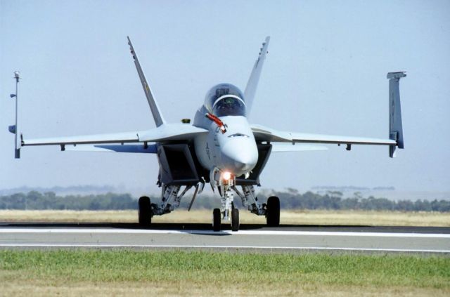 — — - F/A-18 Super Hornet at the 2001 Avalon International Airshow. It had just finished its super routine and landed, then turned to face me, and bowed to the audience. Couldnt have been at a better fence post all day long in the sun! This photo, along with all the others from this airshow are scanned from ancient transparencies. I think from memory, it was Fujichrome 50D, shot through my ye olde Nikon F4E film SLR. Lens was an 80-200/f2.8 Nikon. - Awesome stuff!
