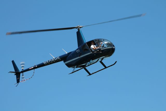 Robinson R-44 (N508HS) - Prepping for a golf ball drop.