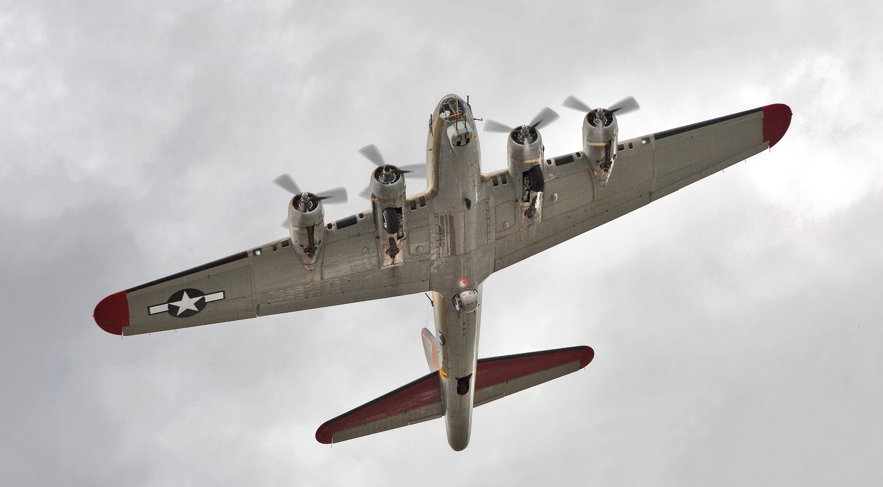 — — - Boeing B-17G, Nine O Nine, N93012 over the Museum of Flight parking lot, Boeing Field, Seattle, WA. Canon 5D MkII w/ 100mm lens.  Just stepped out of my car with seconds to grab this shot.