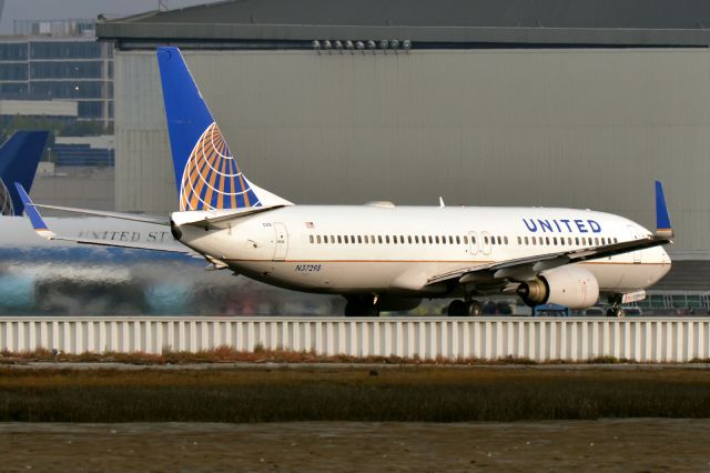 Boeing 737-800 (N37298) - About to take off ... Air Force One is seen in the background.  President Barack Obama was in town over the weekend.  11th Oct., 2014