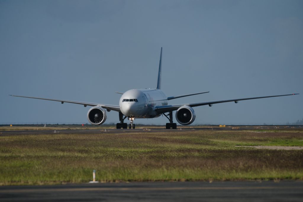 BOEING 777-200LR (N879FD) - FDX1413 taxiing after a morning Kona winds arrival on runway 26L on 11 January 2024.