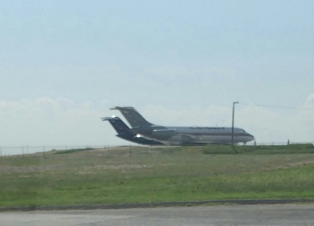 Douglas DC-9-10 — - Two dc-9s on the ground 1 USA jet and 1 kalitta charters.