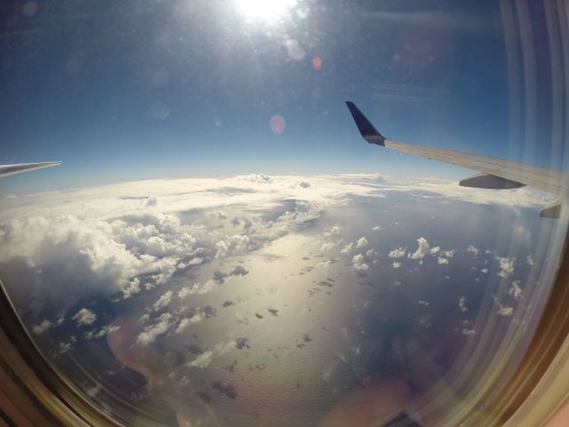 Boeing 737-700 — - Just a neat fisheye lens picture of the wing and elevator on a nice flight back from SXM