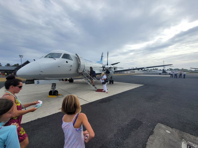 Saab 340 (E5-EFS) - GZ1612 taking on people and cargo for the trip to Aitutaki.