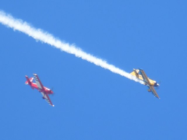 EXTRA EA-300 (N580GP) - Matt Chapman flying the (yellow) Eagle 580 at Thunder in the Desert 2014.